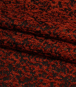 Folded Galaxy fabric showing the depth of the woven design and textured finish in copper and black tones.
