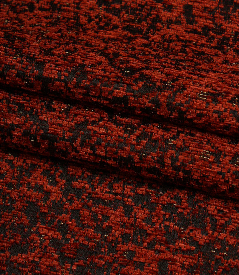 Folded Galaxy fabric showing the depth of the woven design and textured finish in copper and black tones.