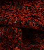 Detailed close-up of Galaxy fabric revealing the intricate weave and textured contemporary design in copper and black tones.