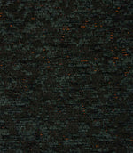 Close-up of Galaxy emerald upholstery fabric showcasing the richly textured weave, contrasting black yarns and shimmering copper flecks.
