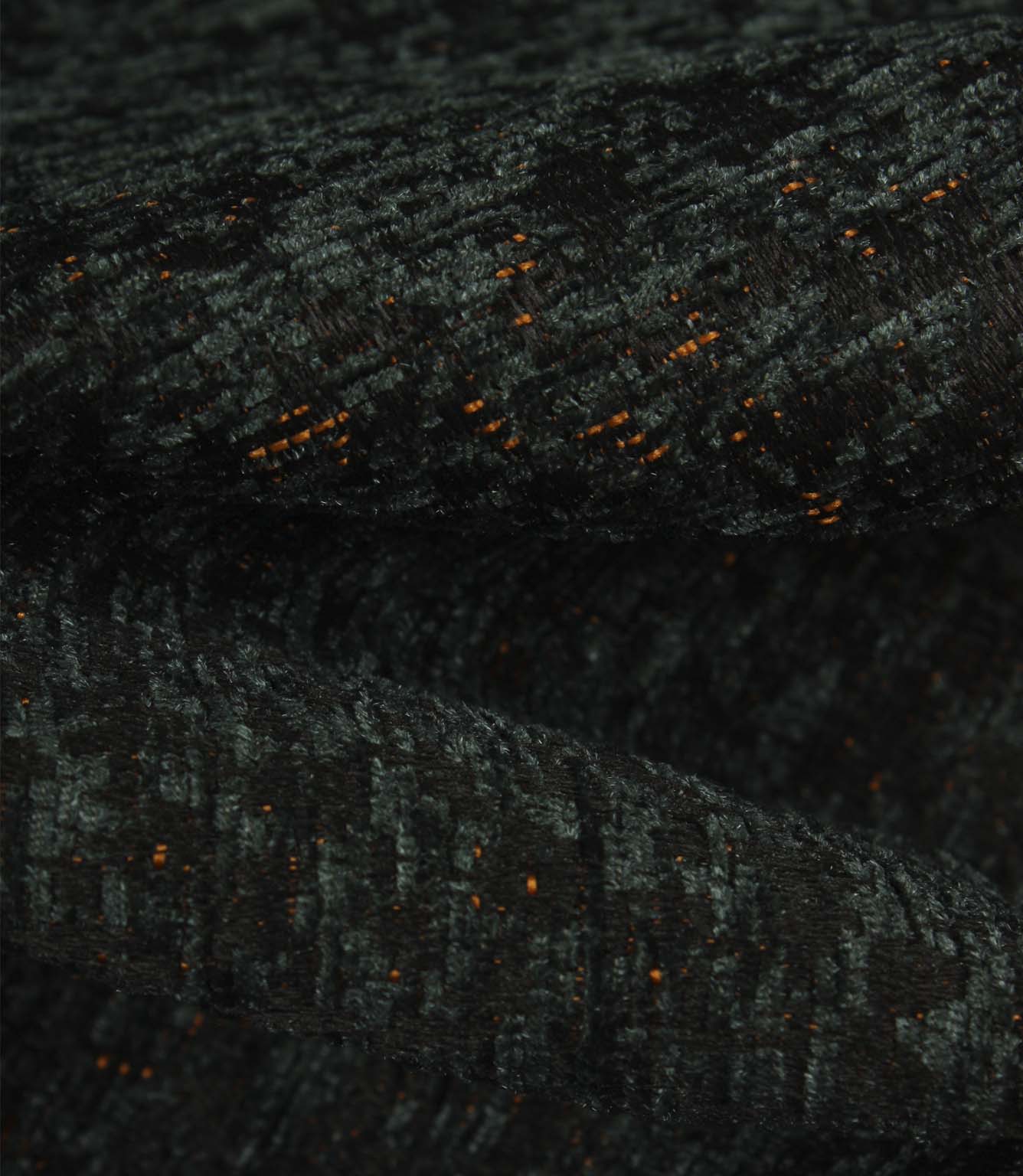 Detailed macro view of Galaxy emerald upholstery fabric, revealing the tactile texture, layered weave and subtle metallic copper highlights.