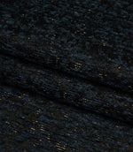 Folded Galaxy fabric in navy and black tones highlighting the depth, texture and contemporary woven design.