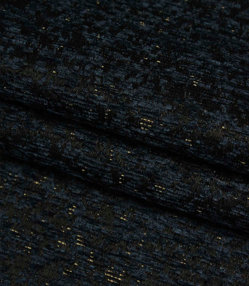 Folded Galaxy fabric in navy and black tones highlighting the depth, texture and contemporary woven design.