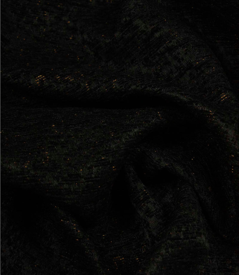Draped Galaxy noir fabric highlighting its soft texture, elegant movement and understated metallic accents.