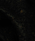 Detailed close-up of Galaxy contemporary fabric in noir black, featuring textured yarns and shimmering metallic flecks.