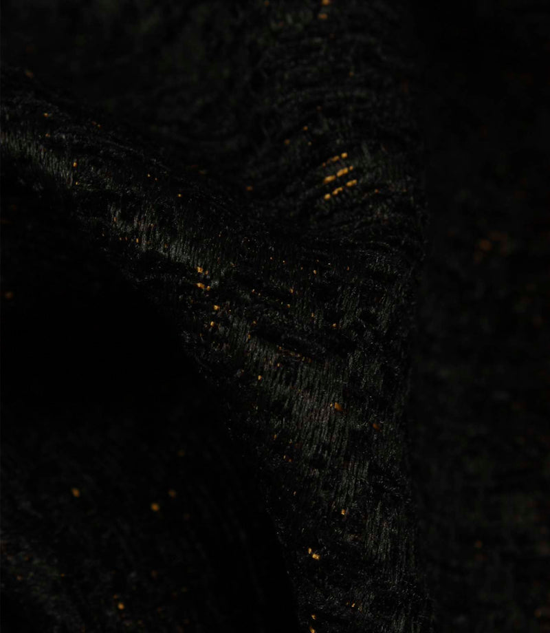 Detailed close-up of Galaxy contemporary fabric in noir black, featuring textured yarns and shimmering metallic flecks.