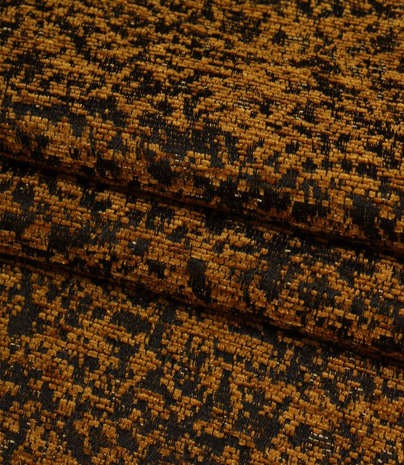 Folded Galaxy fabric in warm ochre tones displaying the intricate abstract weave and dimensional texture.