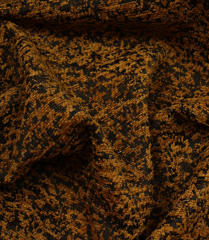 Draped Galaxy ochre fabric highlighting its soft handle, textured woven pattern and elegant movement.