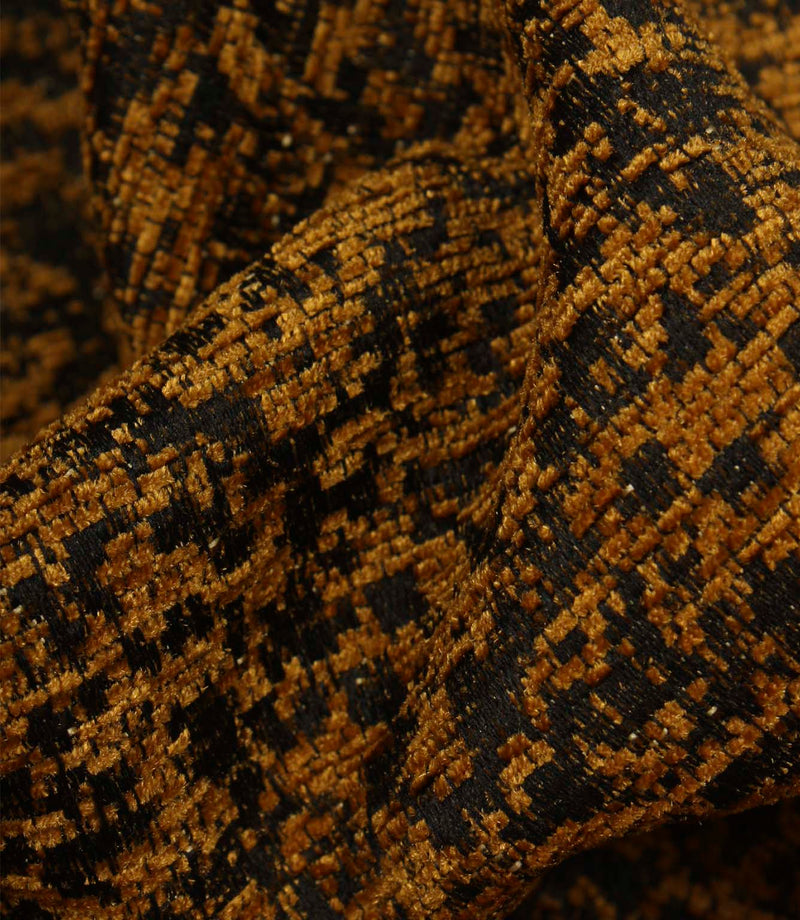Detailed close-up of Galaxy upholstery fabric in ochre and black, revealing the tactile weave and subtle metallic detailing.