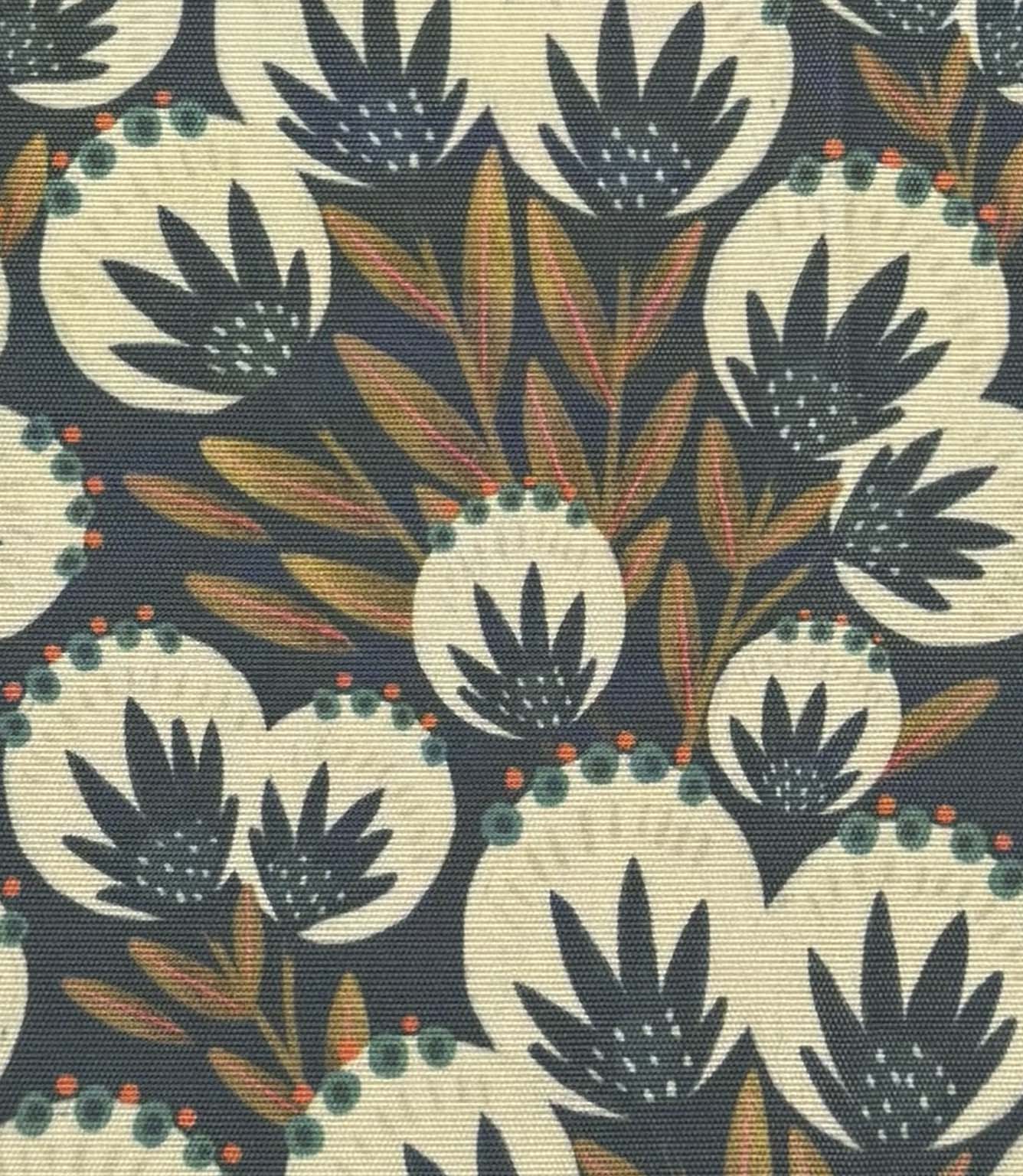 Close-up of Ember Crest outdoor fabric with layered foliage motifs in soft ivory, teal, burnt orange, and deep blue tones.