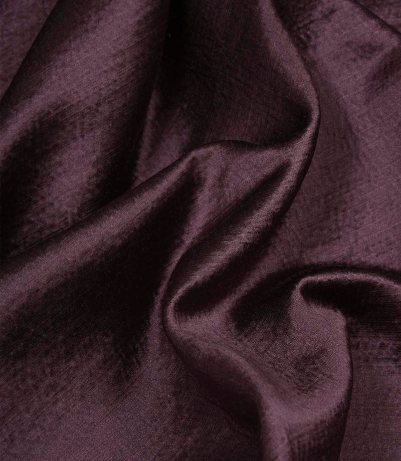 Glaze plum satin-style fabric draped in soft folds, showcasing its luxurious sheen and fluid movement.