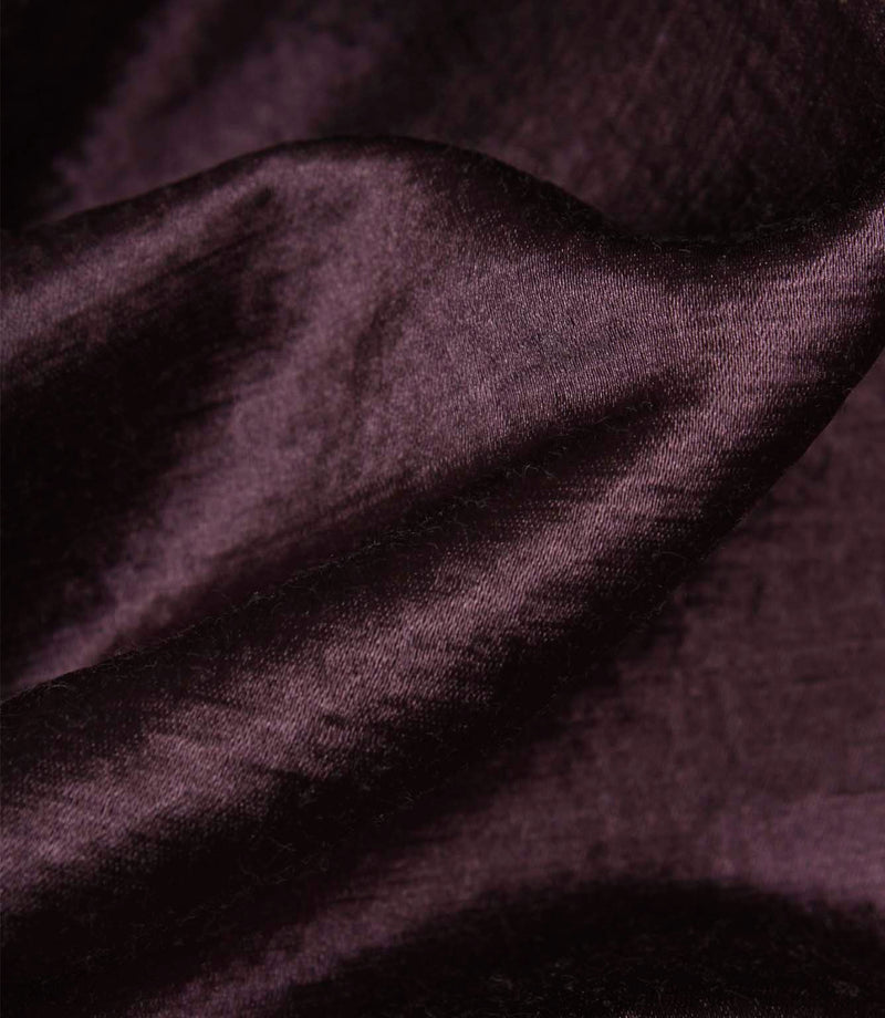Detailed view of folded Glaze plum faux silk fabric displaying its rich sheen, smooth texture and elegant drape.
