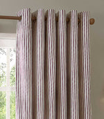 A close-up of striped curtain panels hanging from a wooden rod. The curtains have vertical stripes in brown, beige, and muted red/pink, with grommets on the side.