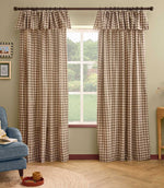 Pair of Harriet natural beige and cream gingham check fully lined curtains with ruffle flop-top headers, framing a large window in a relaxed living room.