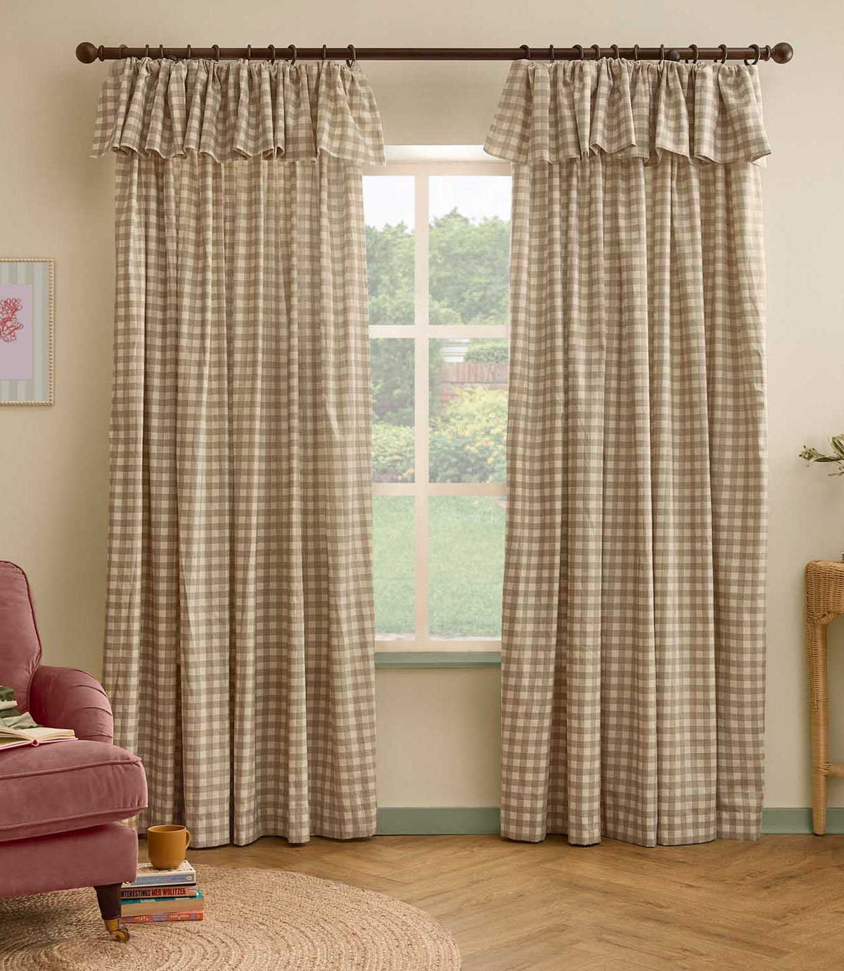 Pair of natural beige and cream gingham check curtains with ruffle flop-top headers framing a large window in a softly styled living room.