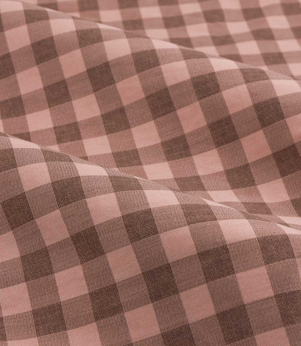 Close-up detail of Harriet pink and brown gingham check fabric arranged in soft folds, showing the woven texture and evenly spaced checked design.