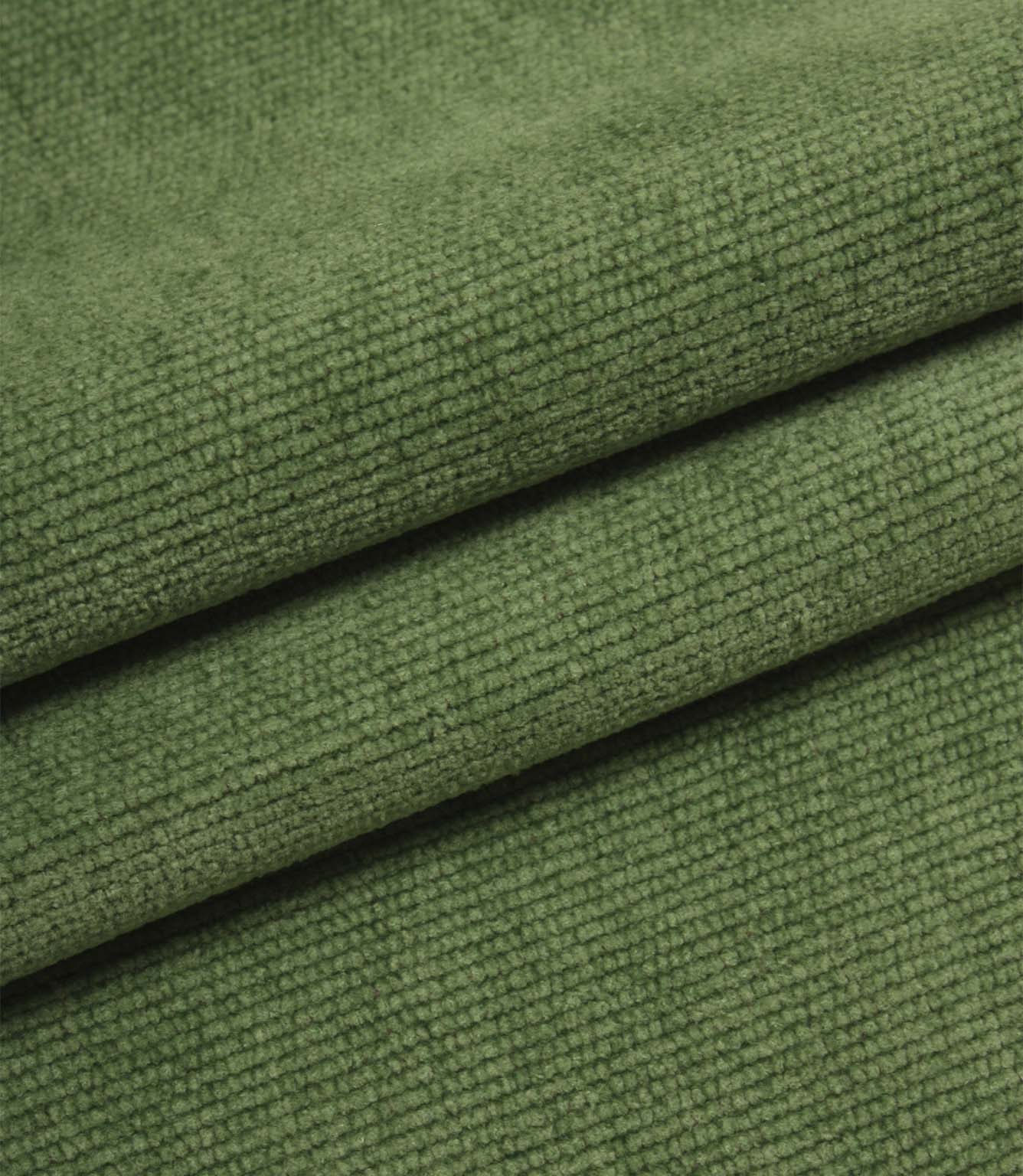 Folded emerald green woven upholstery fabric showcasing the soft texture and durable construction of Hartwell.