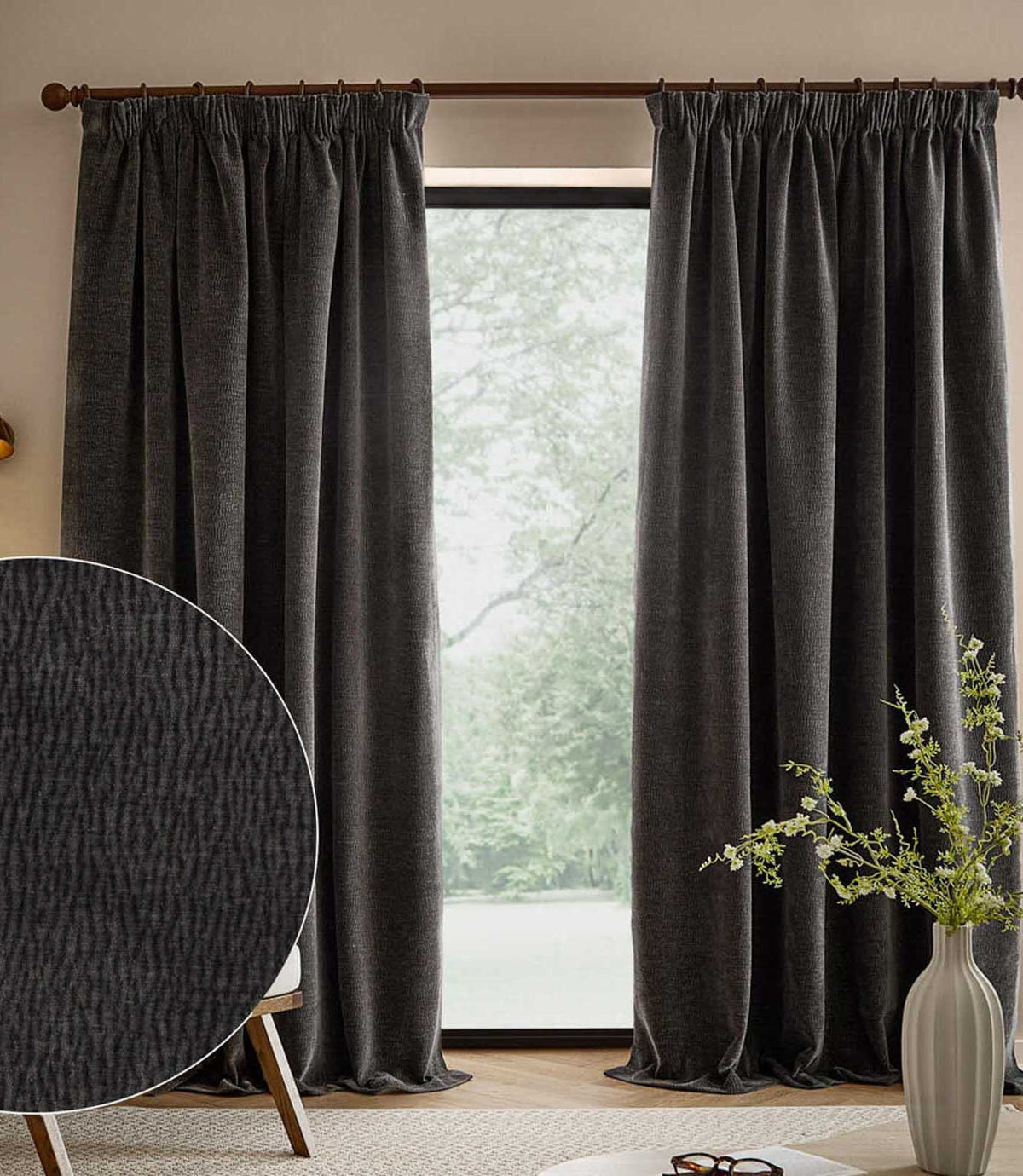 Charcoal grey Heath washed velvet pencil pleat curtains frame a large window, with an inset close-up showing the textured fabric.