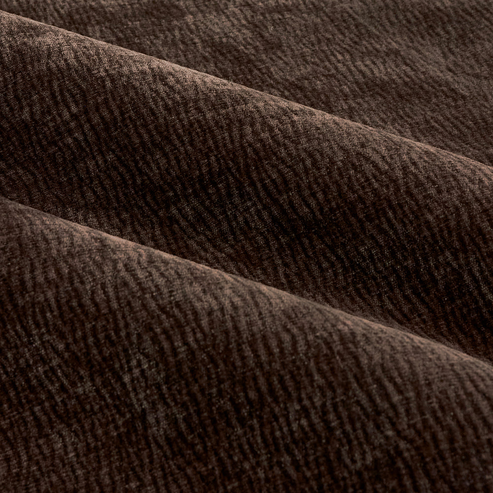 Close-up of espresso brown washed velvet curtain fabric arranged in soft folds, highlighting its rich texture, subtle ribbed pattern and plush finish.