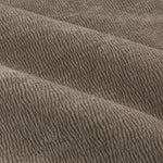Close-up of greige washed velvet curtain fabric arranged in soft folds, highlighting its plush surface, fine ribbed texture and subtle tonal variation.