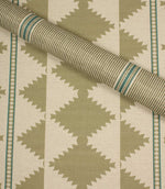 Fabric with geometric pattern in green and beige tones
