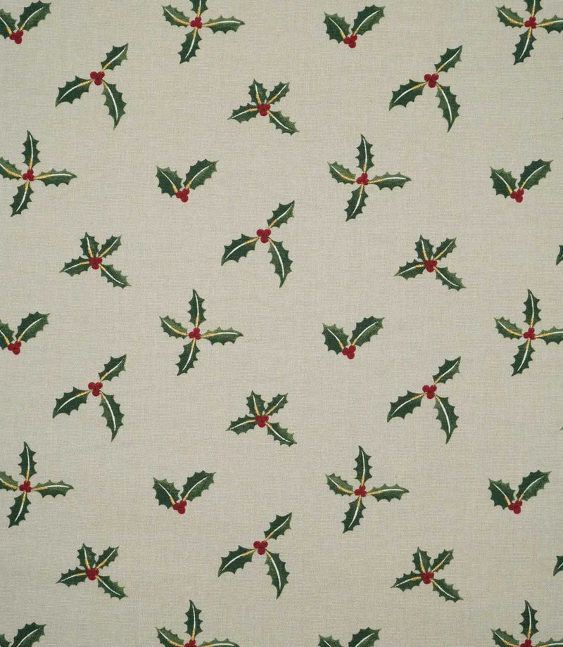 Holly and Berry Stone Christmas fabric featuring a repeating pattern of dark green holly leaves and red berries on a warm stone neutral background.