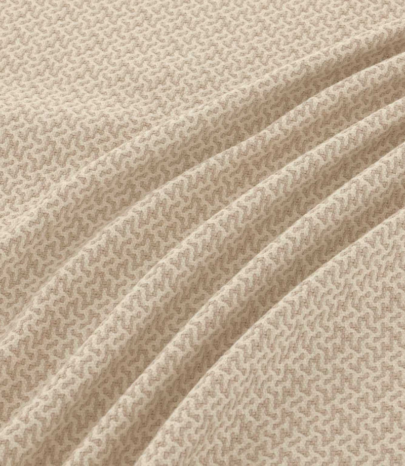 Horton Gull beige and cream geometric fabric draped in gentle folds, highlighting its subtle pattern, woven texture and natural-looking drape.