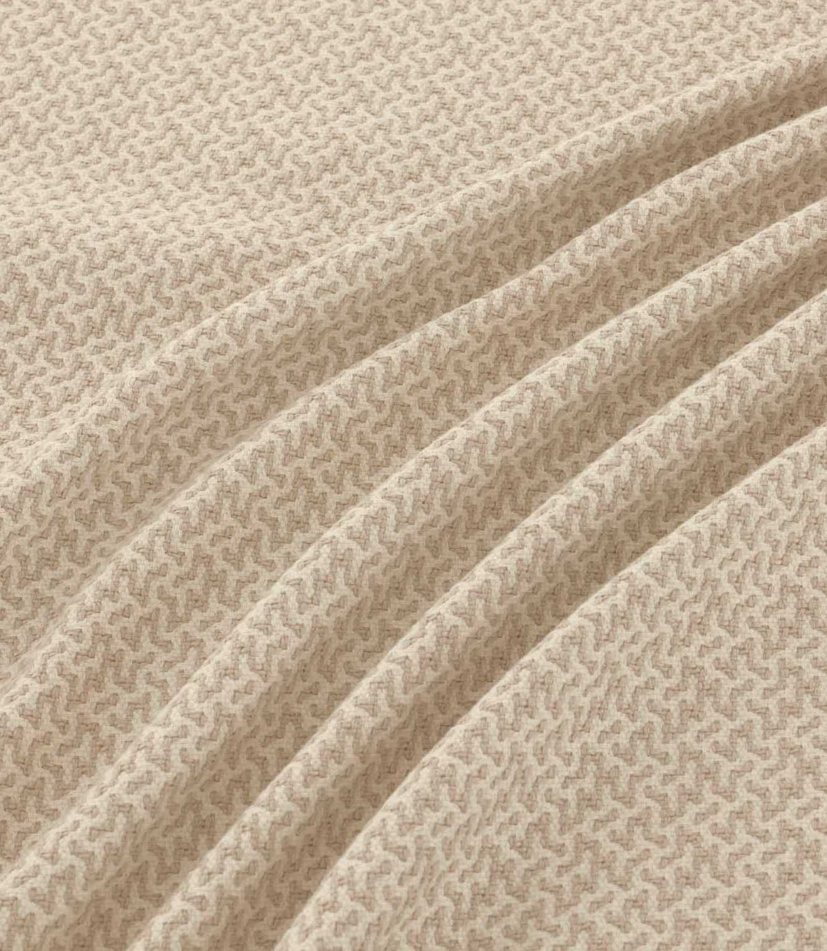 Horton Gull beige and cream geometric fabric draped in gentle folds, highlighting its subtle pattern, woven texture and natural-looking drape.
