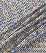 Horton Nautica blue and cream geometric fabric gathered into soft folds, displaying its detailed repeating pattern and textured woven finish.