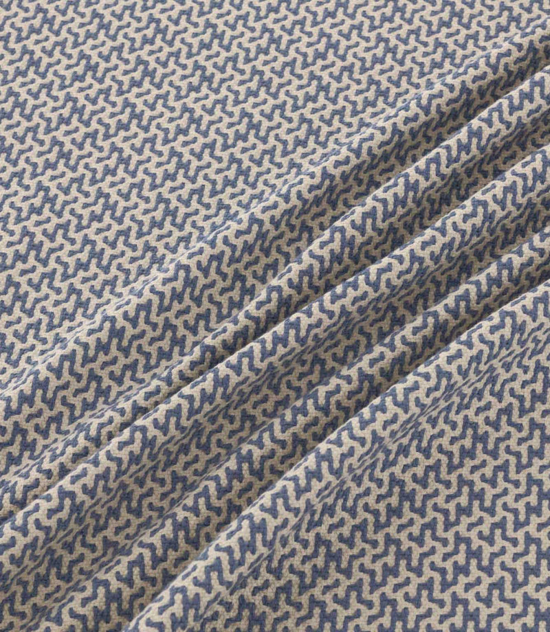 Horton Nautica blue and cream geometric fabric gathered into soft folds, displaying its detailed repeating pattern and textured woven finish.