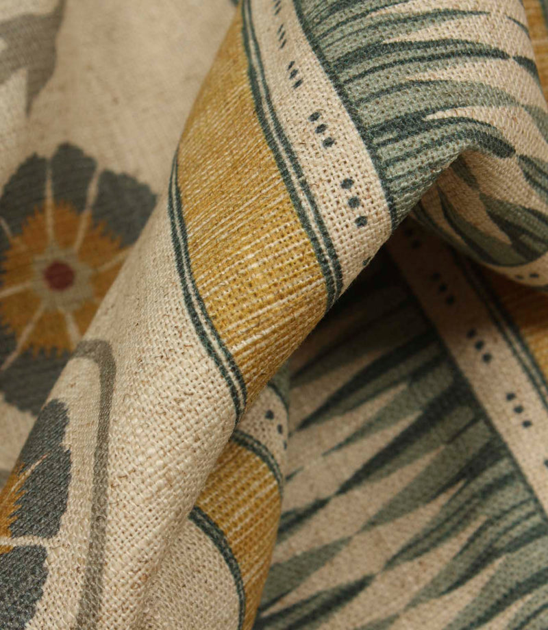 Detailed close-up of textured stripe fabric showing woven-effect bands and floral motifs with a soft rustic finish.