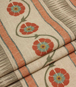 Folded striped floral fabric with flowing vine details and textured woven-style stripes in coral and taupe tones.