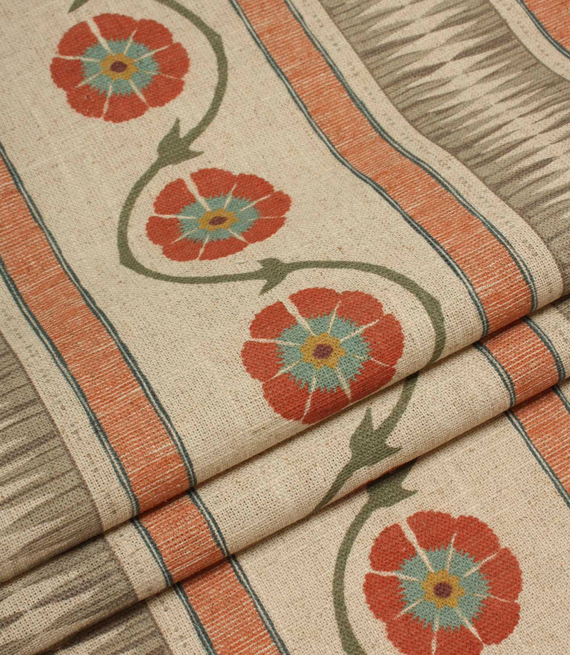 Folded striped floral fabric with flowing vine details and textured woven-style stripes in coral and taupe tones.