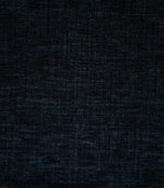 Close-up of Insernia Velvet Night plain fabric, showing its dark navy and charcoal tones with a softly distressed, crosshatched texture and subtle variations in the velvet pile.