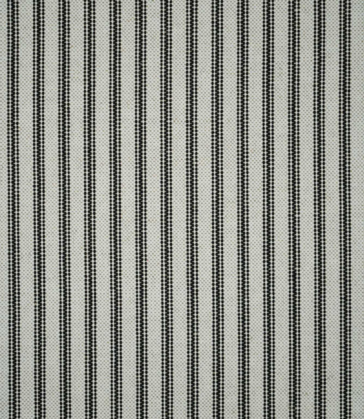Black ticking stripe fabric with evenly spaced woven vertical stripes on a natural cream background, showing the classic striped pattern and textured weave.