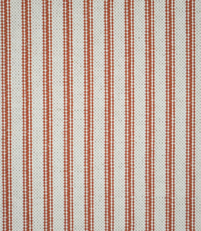 Close-up of Linen Ticking Burnt Orange fabric featuring evenly spaced burnt orange woven stripes on a textured natural cream background.