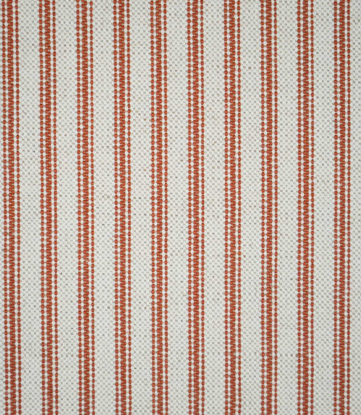 Close-up of Linen Ticking Burnt Orange fabric featuring evenly spaced burnt orange woven stripes on a textured natural cream background.