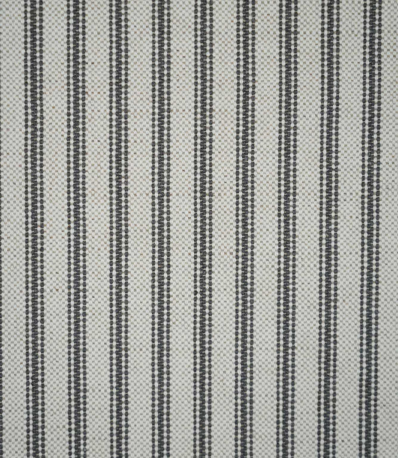 Grey ticking stripe fabric with evenly spaced charcoal grey woven stripes on a natural cream background, showing the classic striped design and textured weave.