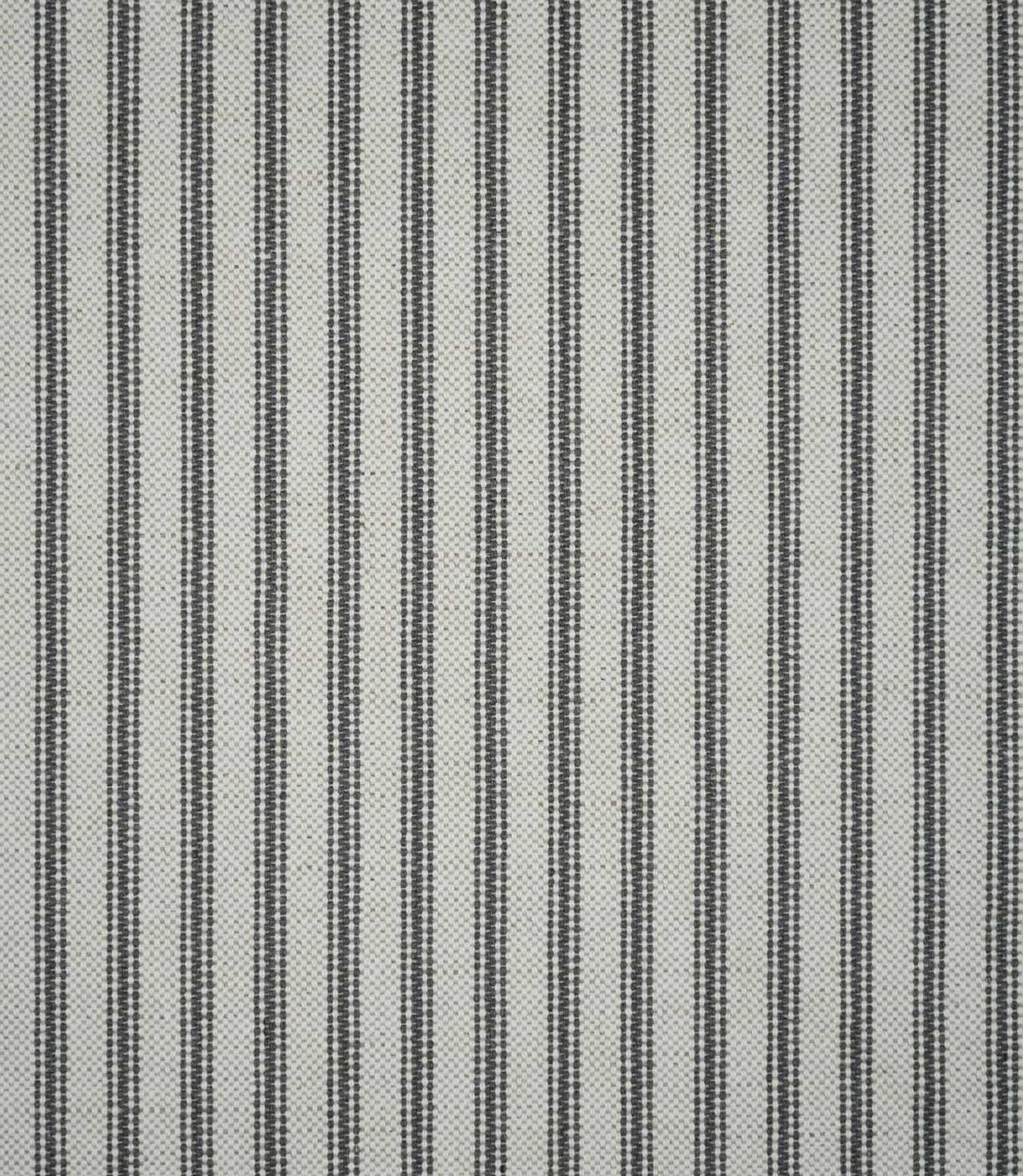 Full view of grey ticking stripe fabric featuring repeating narrow charcoal grey stripes woven across a natural cream textured ground.
