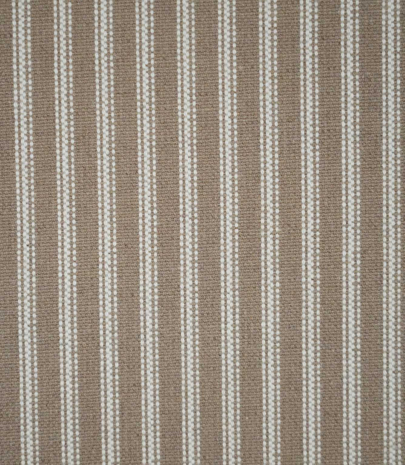 Natural ticking stripe fabric with evenly spaced ivory woven stripes on a warm taupe-beige background, showing the classic striped design and textured weave.