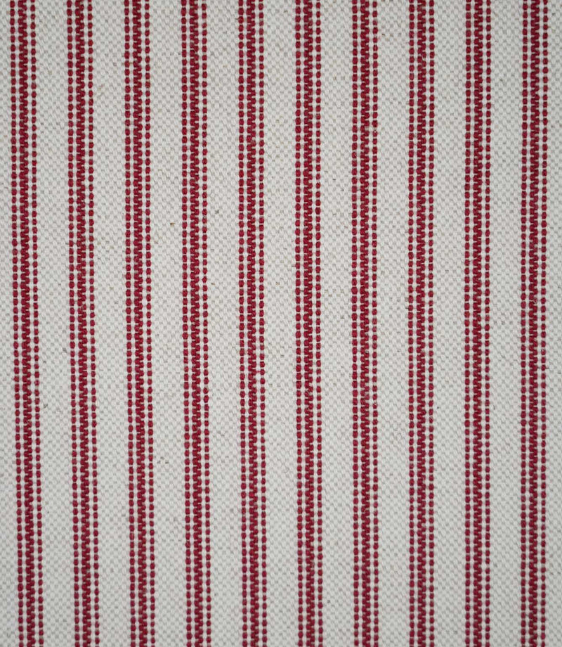 Close-up of red ticking stripe fabric featuring narrow woven red stripes on a natural cream background, highlighting the textured weave and classic striped design.