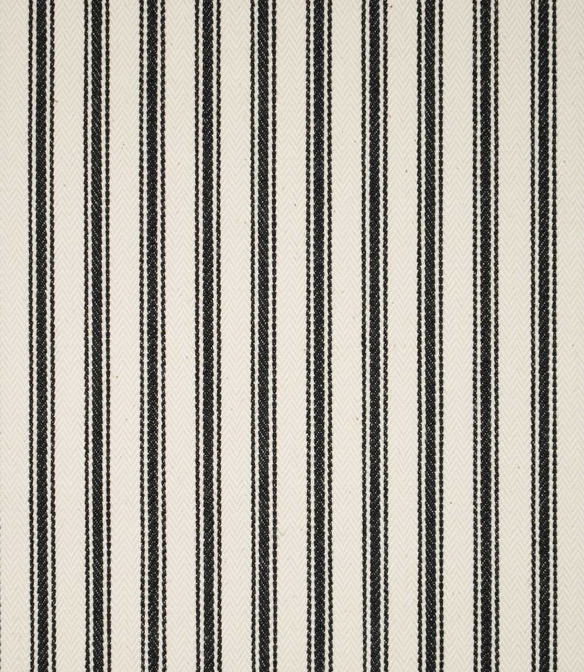 JF Ticking Black fabric featuring classic vertical black ticking stripes on a warm cream background with a subtle herringbone woven texture.