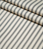 JF Ticking Grey striped fabric laid flat and neatly folded, showing the repeating grey ticking stripe pattern and textured cream weave.