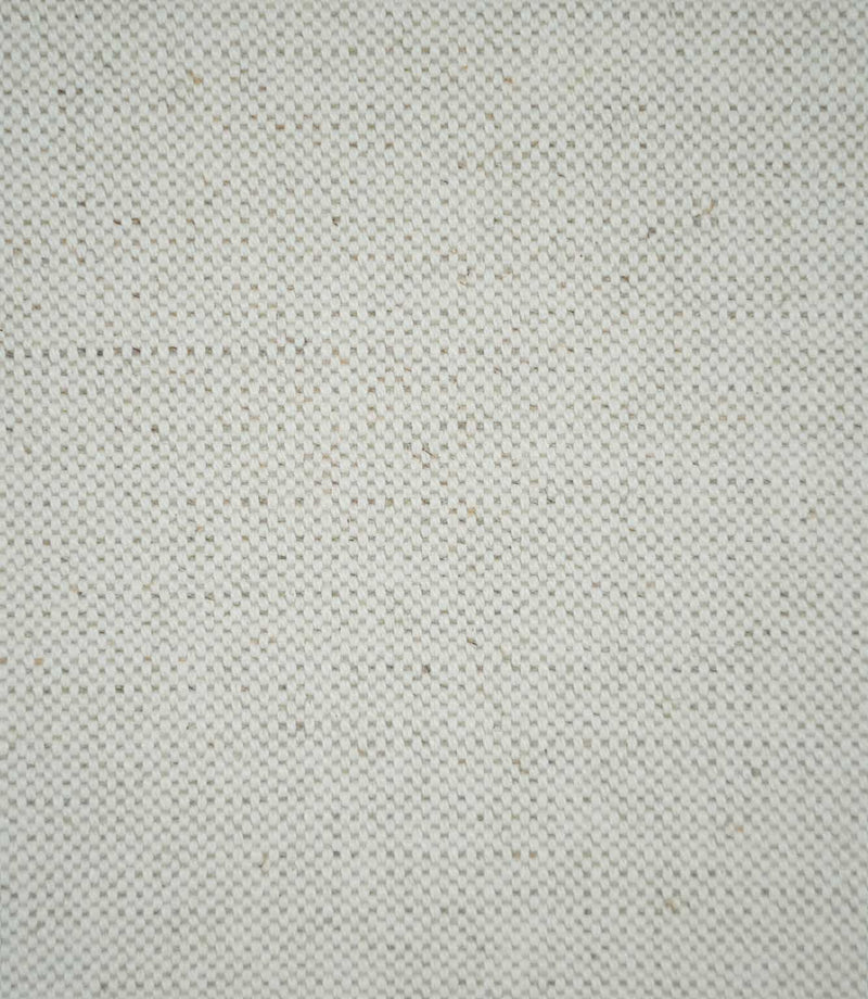 Close-up of JF Ticking Plain Natural fabric showing its cream and ivory tones, tightly woven plain weave texture and subtle beige flecks throughout the material.