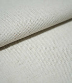 Close-up of JF Ticking Plain Natural fabric folded over itself, revealing its substantial woven texture, ivory cream colour and fine beige yarn detailing.
