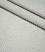 JF Ticking Plain Natural fabric arranged in overlapping folds, showing the plain weave construction, natural cream colouring and softly textured surface.