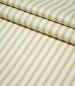 JF Ticking Sage Green striped fabric arranged in neat folds, showing the evenly spaced green stripes and textured cream herringbone weave.