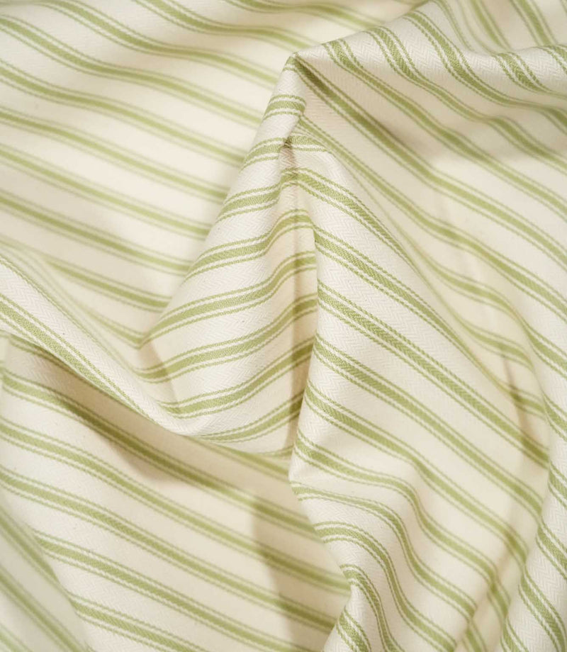 JF Ticking Sage Green fabric draped in soft folds, highlighting the classic sage green ticking stripe design, woven texture and natural drape.