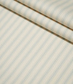 JF Ticking Seaspray striped fabric arranged in neat folds, highlighting the repeating pale blue stripes and subtle textured herringbone weave.
