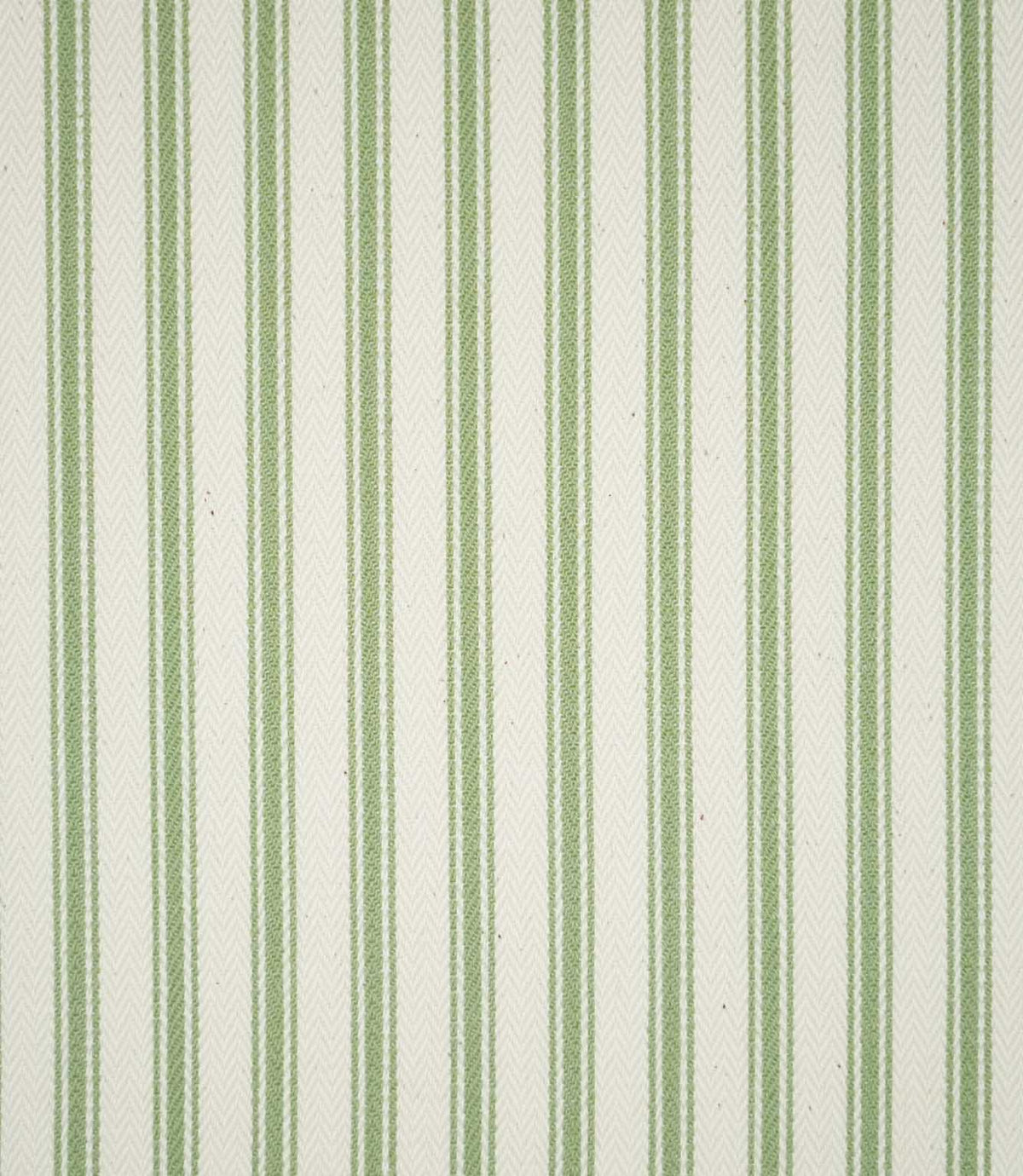 Close-up of JF Ticking Warm Green fabric featuring repeating sage green vertical ticking stripes on a warm cream background, with a subtle herringbone weave adding texture.